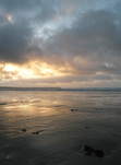 JT00128 Sunrise over pebble on Tramore beach (Brownstown head) levelled.jpg